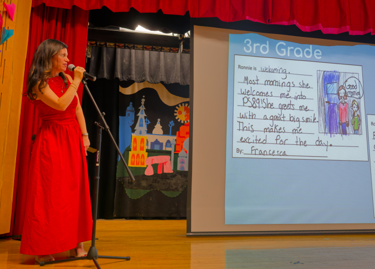Parent coordinator Christina Rossi, to become interim vice principal next school year, presents comments and drawings from children about their principal. Photo: Carl Glassman/Tribeca Trib